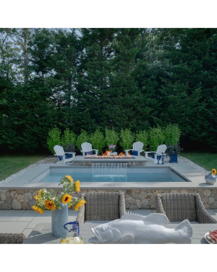 Backyard pool with fire pit and waterfall feature