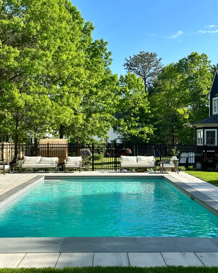 Custom rectangular pool glowing at dusk